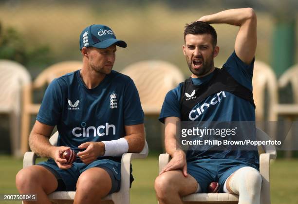 Joe Root and Mark Wood of England look on during the England Net Session at Saurashtra Cricket Association Stadium on February 13, 2024 in Rajkot,...