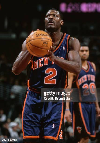 Larry Johnson, Power Forward and Small Forward for the New York Knicks prepares to make a free throw during the NBA Midwest Division basketball game...