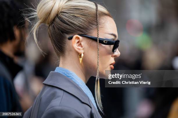 Guest wears sunglasses outside Coach on February 12, 2024 in New York City.
