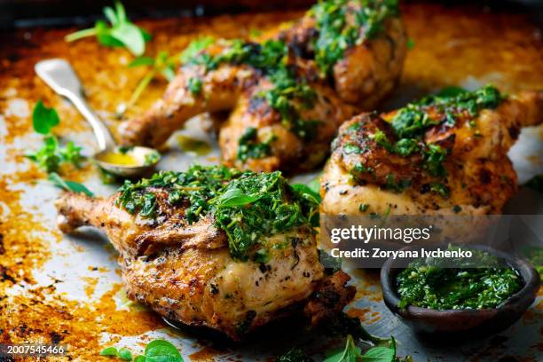 chicken a grill with chimichury sauce - grilled chicken stock pictures, royalty-free photos & images