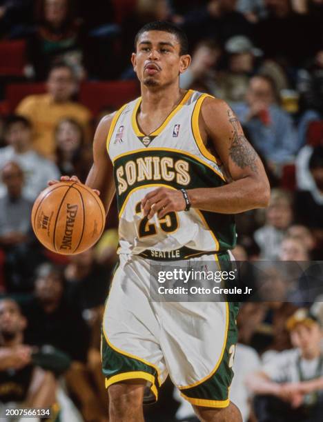 Earl Watson, Point Guard for the Seattle SuperSonics in motion dribbling the basketball down court during the NBA Pacific Division basketball game...