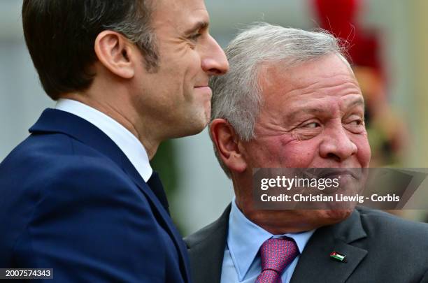 French President Emmanuel Macron welcomes King Abdullah II of Jordan before a meeting at the Elysee Palace on February 16, 2024 in Paris, France.