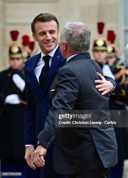 French President Emmanuel Macron welcomes King Abdullah II of Jordan before a meeting at the Elysee Palace on February 16, 2024 in Paris, France.