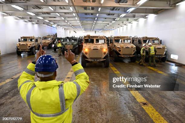 Military vehicles are loaded on to the ship Anvil Point at Sea Mounting Centre, on February 13, 2024 in Marchwood, England. 1,500 UK troops and 600...