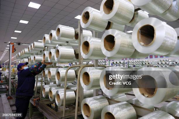 An employee works at a workshop of Chongqing Sanlei Fiberglass Co., Ltd. During the Spring Festival holiday on February 11, 2024 in Chongqing, China.