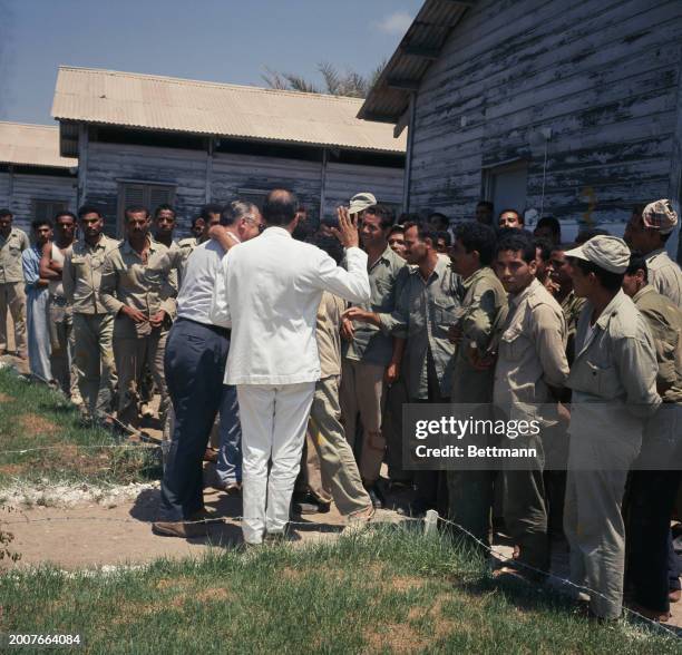 Red Cross official talking with Palestinian men detained in a prisoner of war camp at an unspecified location in Israel, August 12th 1967.