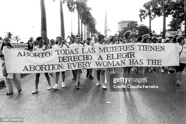 View of abortion-rights demonstrators as they march with a banner towards the end of the Eighth Encuentros Feministas Latinoamericanas y del Caribe ,...