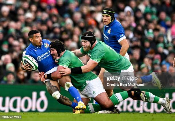 Dublin , Ireland - 11 February 2024; Monty Ieone of Italy is tackled by James Lowe, centre, and Tom O'Toole of Ireland during the Guinness Six...