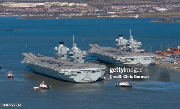 The HMS Prince of Wales leaves Portsmouth Harbor on February 12,2014 in Portsmouth, England. The ship is replacing HMS Queen Elizabeth on Nato trials...