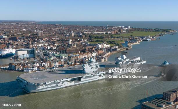 The HMS Prince of Wales leaves Portsmouth Harbor on February 12,2014 in Portsmouth, England. The ship is replacing HMS Queen Elizabeth on Nato trials...