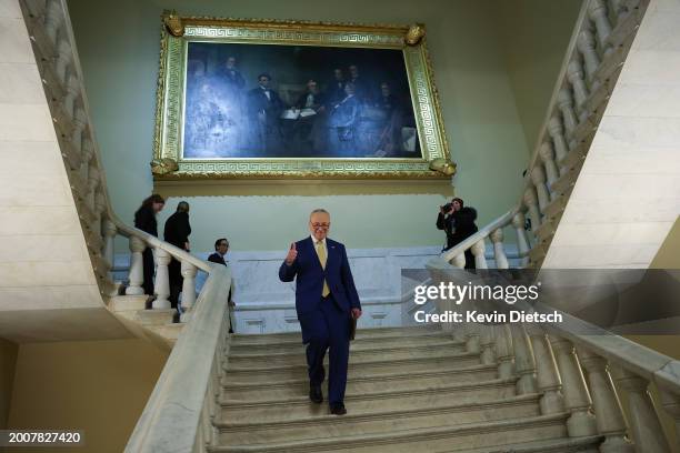 Senate Majority Leader Charles Schumer gives a thumbs-up after speaking on the National Security Supplemental Bill at the U.S. Capitol on February...