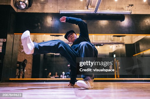 Young Japanese woman doing a hip hop pose for the camera Young Japanese woman doing a hip hop pose for the camera