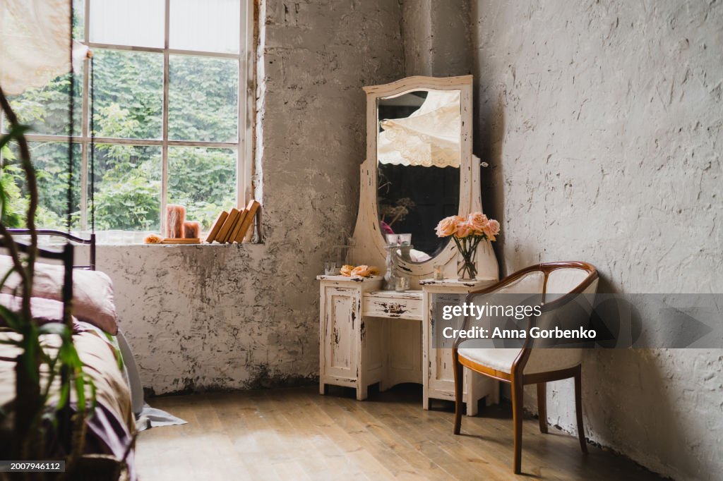 Beautiful vintage bedroom with bed, cupboard, stylish decorations and large windows. Loft, botanic, tropical, rainforest style.
