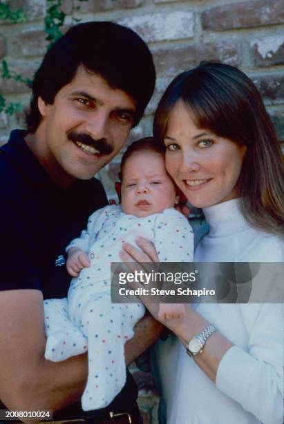 Portrait of married American couple, Olympic swimmer Mark Spitz and Suzy Spitz, with their son, Matthew, Los Angeles, California, 1981.