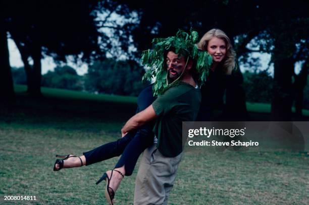 American actor and comedian Bill Murray carries actress Cindy Morgan on the set of the film 'Caddyshack' , Davie, Florida, 1979.