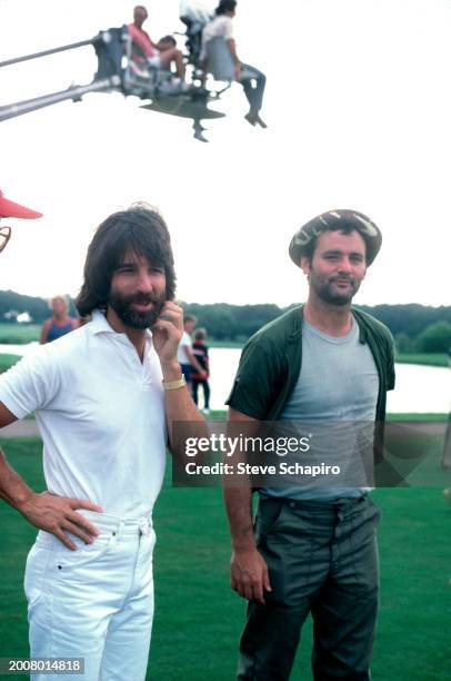 View of American film producer Jon Peters and actor & comedian Bill Murray during the filming of 'Caddyshack' , Davie, Florida, 1979.