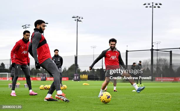 Joe Gomez and Mohamed Salah of Liverpool during a training session at AXA Training Centre on February 13, 2024 in Kirkby, England.