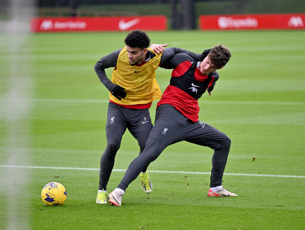 Luis Diaz and Lewis Koumas of Liverpool during a training session at AXA Training Centre on February 13, 2024 in Kirkby, England.