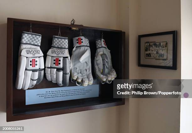 Gloves donated by Joe Root hang on a wall in The Duleep Cricket Pavilion at Rajkumar College pictured after the England Net Session at Saurashtra...