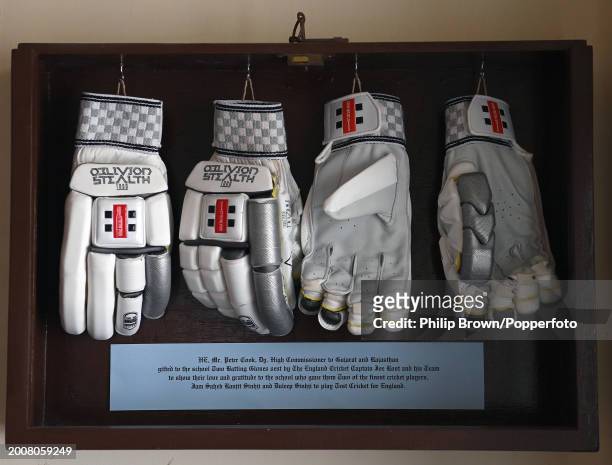 Gloves donated by Joe Root hang on a wall in The Duleep Cricket Pavilion at Rajkumar College pictured after the England Net Session at Saurashtra...