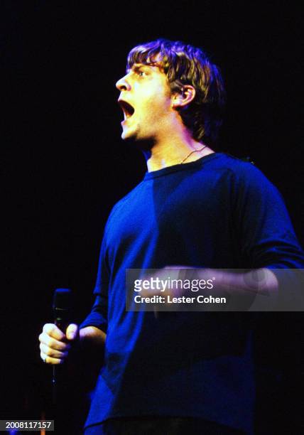 American singer Rob Thomas, of the American rock band Matchbox Twenty, sings on stage during a concert in Los Angeles, California, circa 1996.