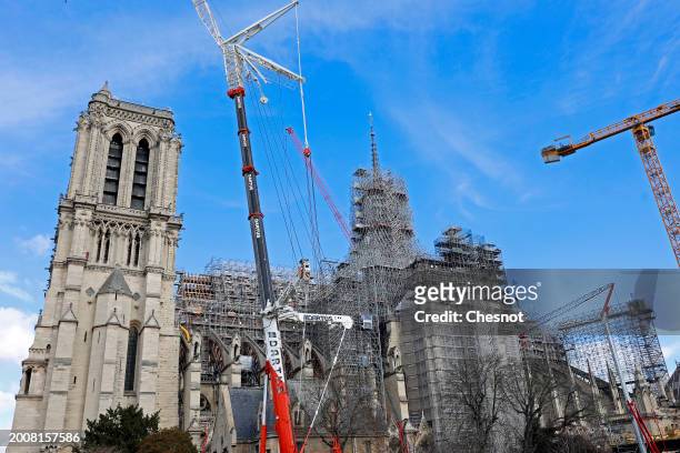 The new golden rooster is seen atop of Notre-Dame de Paris cathedral on February 13, 2024 in Paris, France. The famous Viollet-le-Duc structure of...