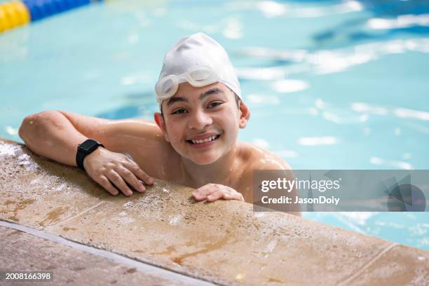portrait of a boy practicing swimming - tween swimsuits stock pictures, royalty-free photos & images