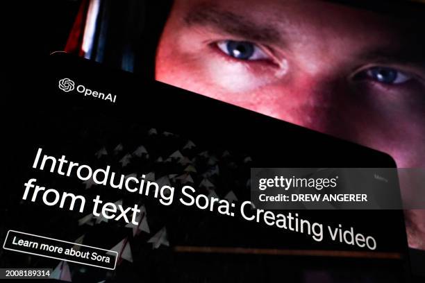 In this photo illustration, a video created by Open AI's newly released text-to-video "Sora" tool plays on a monitor in Washington, DC on February...