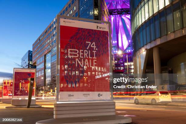 Cars drive past posters for the 2024 Berlinale Berlin International Film Festival ahead of the 74th Berlinale International Film Festival Berlin on...