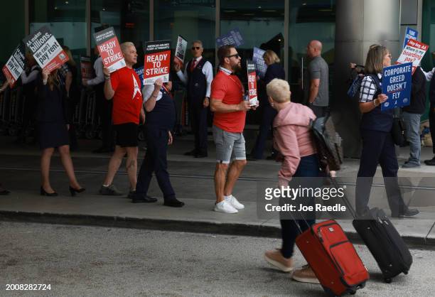 Flight attendants make their voices heard during the Worldwide Flight Attendant Day of Action at the Miami International Airport on February 13, 2024...