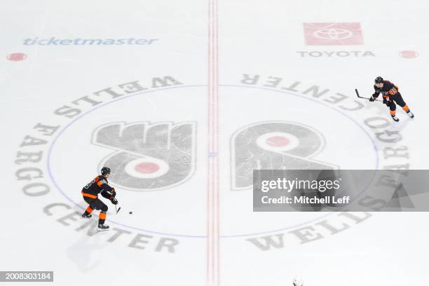 Ryan Poehling and Garnet Hathaway of the Philadelphia Flyers in action against the Arizona Coyotes at the Wells Fargo Center on February 12, 2024 in...