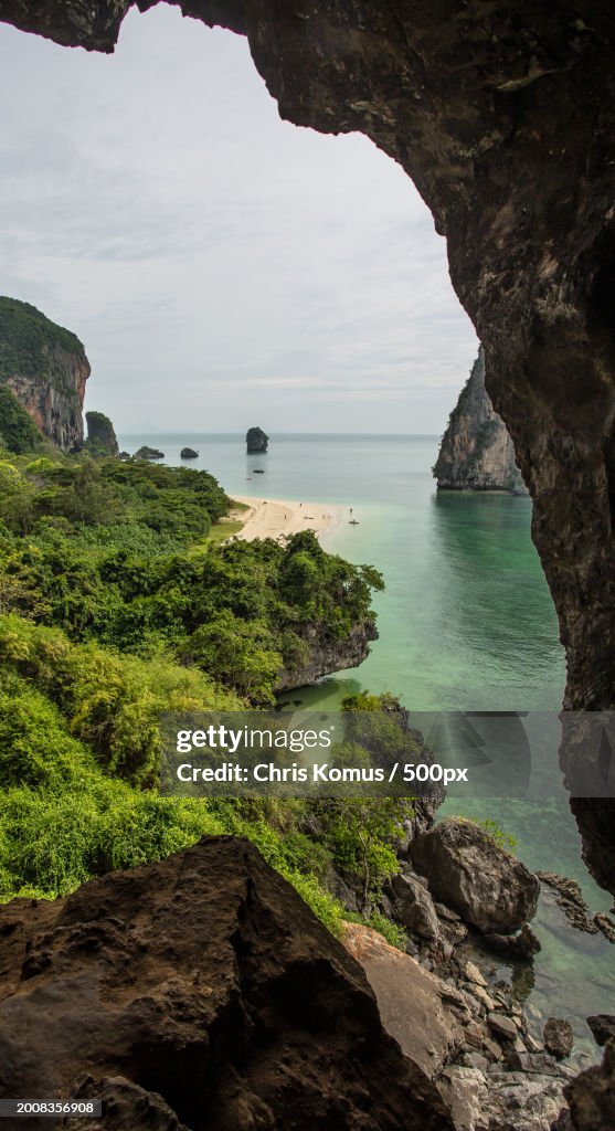 Scenic view of sea seen through cave