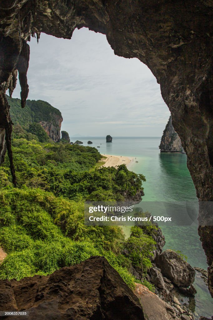 Scenic view of sea seen through cave