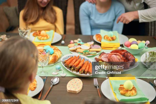 easter lunch with roast pork, vegetables, easter cookies and easter cake - easter meal stock pictures, royalty-free photos & images