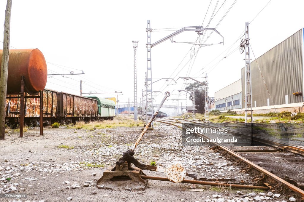 Railway tracks and rusty manual point lever