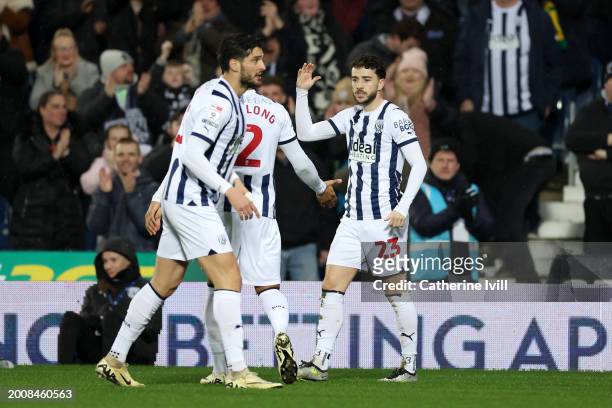 Mikey Johnston of West Bromwich Albion celebrates scoring his team's first goal with teammates during the Sky Bet Championship match between West...