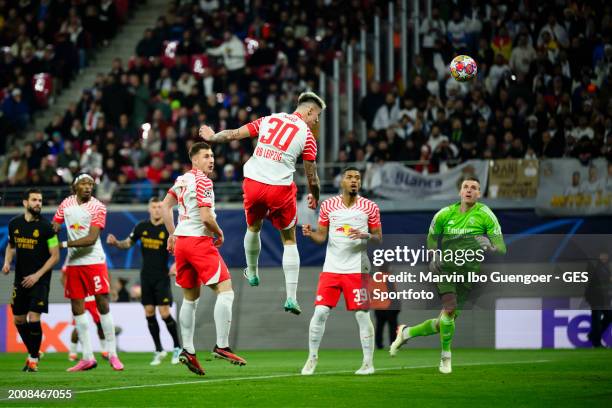 Benjamin Sesko of Leipzig controls the ball prior non given goa during the UEFA Champions League 2023/24 round of 16 first leg match between RB...