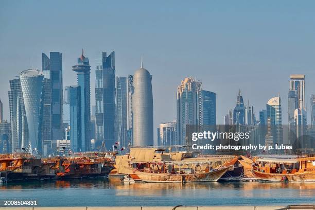 the many skycrapers that face doha bay - doha, qatar - doha stock pictures, royalty-free photos & images