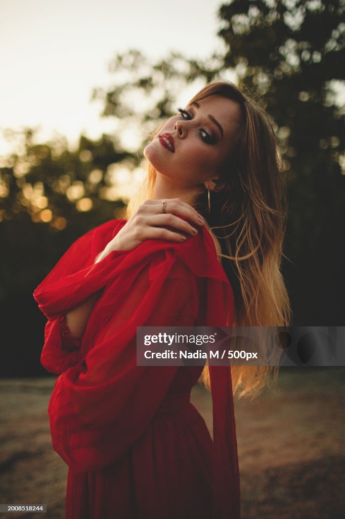 Beautiful Model in Red Dress at Sunset,Elephant Rocks State Park,United States,USA