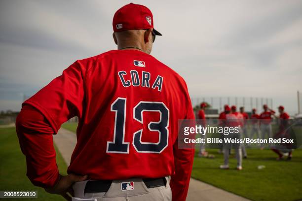 Manager Alex Cora of the Boston Red Sox looks on during a spring training team workout on February 16, 2024 at jetBlue Park at Fenway South in Fort...
