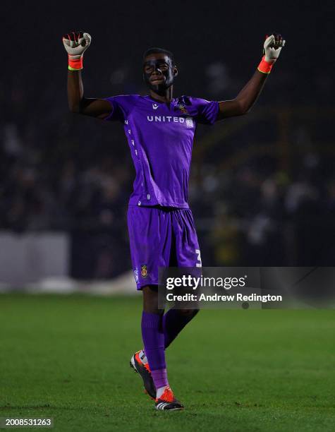 Arthur Okonkwo of Wrexham celebrates his side's first goal whilst wearing a protective face mask during the Sky Bet League Two match between Sutton...