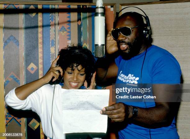 American musicians Rebbie Jackson and Isacc Hayes sing in studio during the recording of Jackson's song 'Tonight I'm Yours' in Los Angeles,...