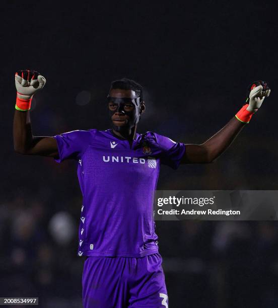 Arthur Okonkwo of Wrexham celebrates his side's first goal whilst wearing a protective face mask during the Sky Bet League Two match between Sutton...