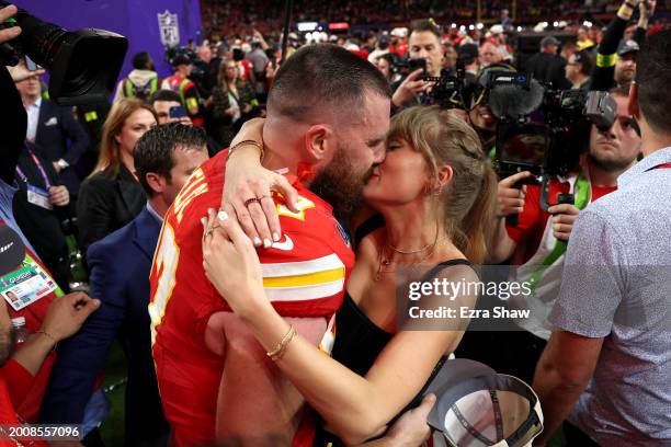 Travis Kelce of the Kansas City Chiefs and Taylor Swift embrace after defeating the San Francisco 49ers in overtime during Super Bowl LVIII at...