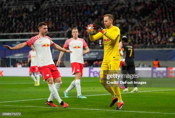 Péter Gulácsi of RB Leipzig controls the ball during the UEFA Champions League 2023/24 round of 16 first leg match between RB Leipzig and Real Madrid...