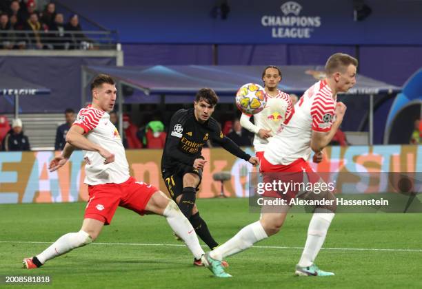 Brahim Diaz of Real Madrid scores his team's first goal during the UEFA Champions League 2023/24 round of 16 first leg match between RB Leipzig and...