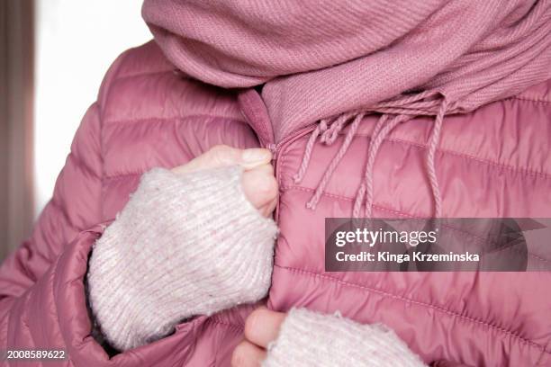 getting dressed - pink coat stock pictures, royalty-free photos & images