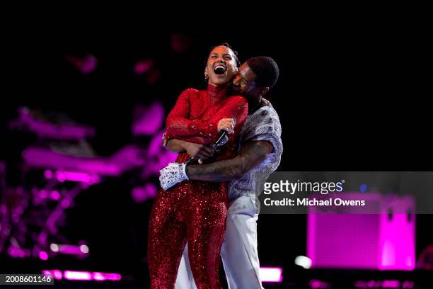 Usher performs with Alicia Keys during the Apple Music halftime show at the NFL Super Bowl 58 football game between the San Francisco 49ers and the...
