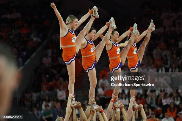 Clemson cheerleaders perform during a college basketball game between the Miami Hurricanes and the Clemson Tigers on February 14, 2024 at Littlejohn...