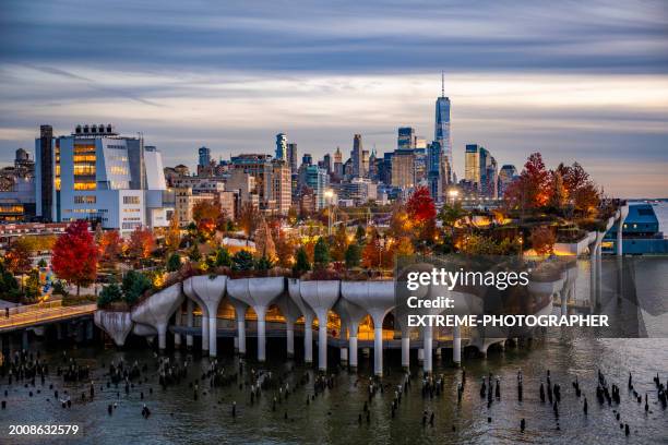 magical moment of the little island at pier 55 in the hudson river seen during the sunset - river hudson stock pictures, royalty-free photos & images